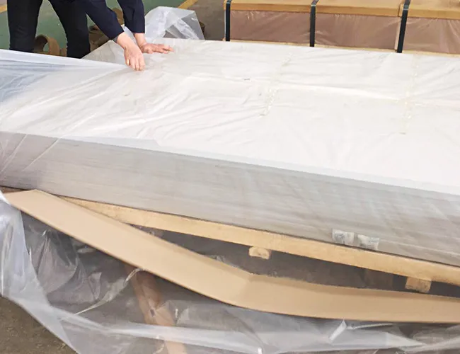 Seaworthy moisture-barrier packaging of marine aluminum plates with Plastic Interleaving and Paper